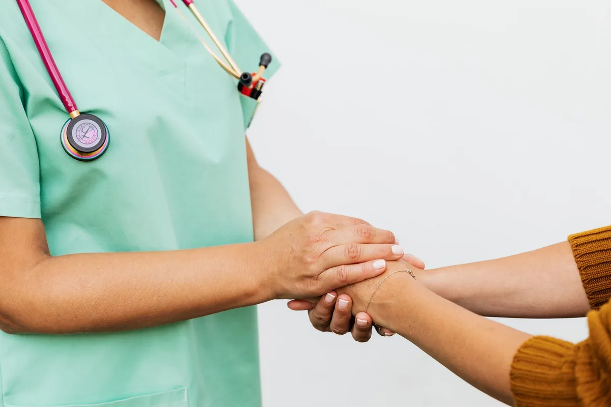 nurse and patient talking empathetic listening